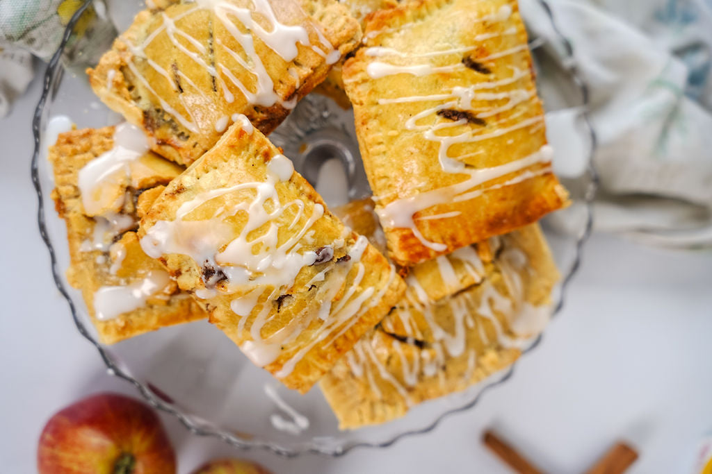 Grain-Free apple hand pies on a glass cake plate