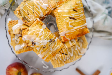 Grain-Free apple hand pies on a glass cake plate
