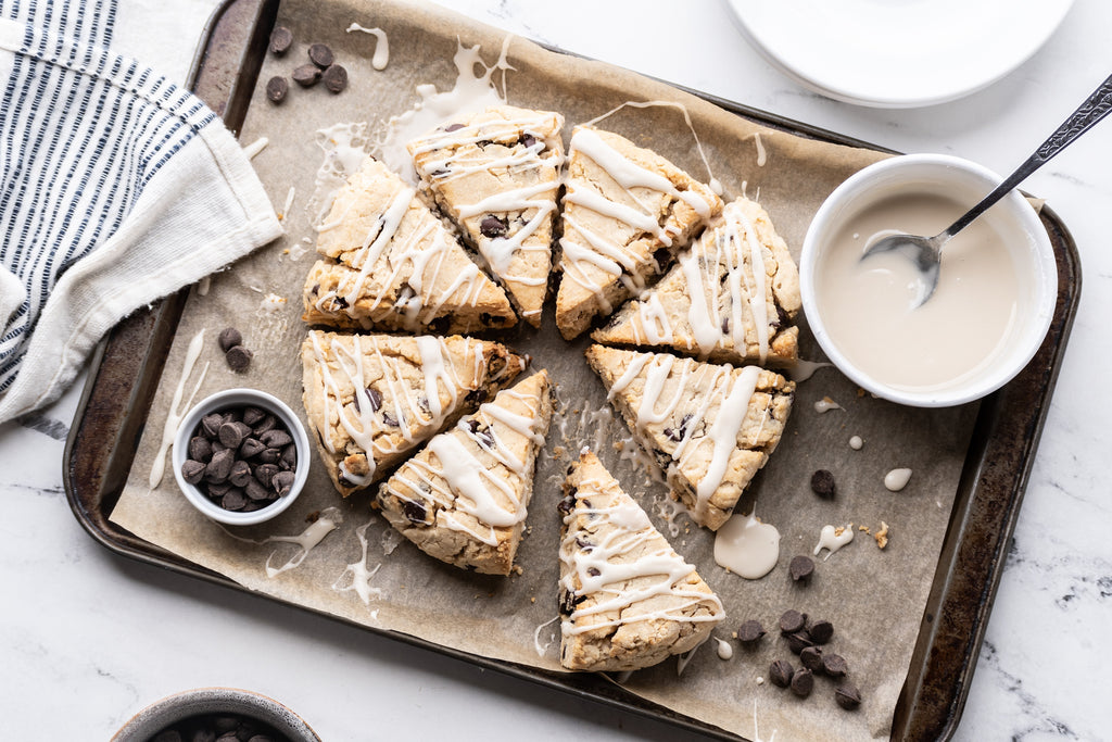 tray with 8 triangle grain-free eggless chocolate chip scones, drizzled with icing