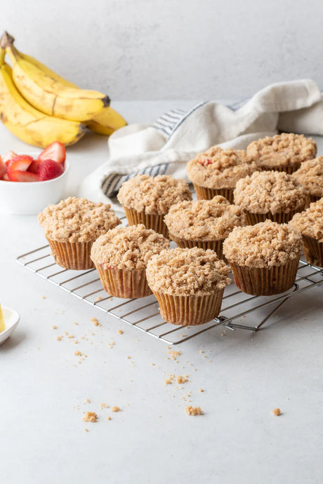 Freshly baked muffins with fresh strawberries and an Otto's Naturals Cassava flour bag 