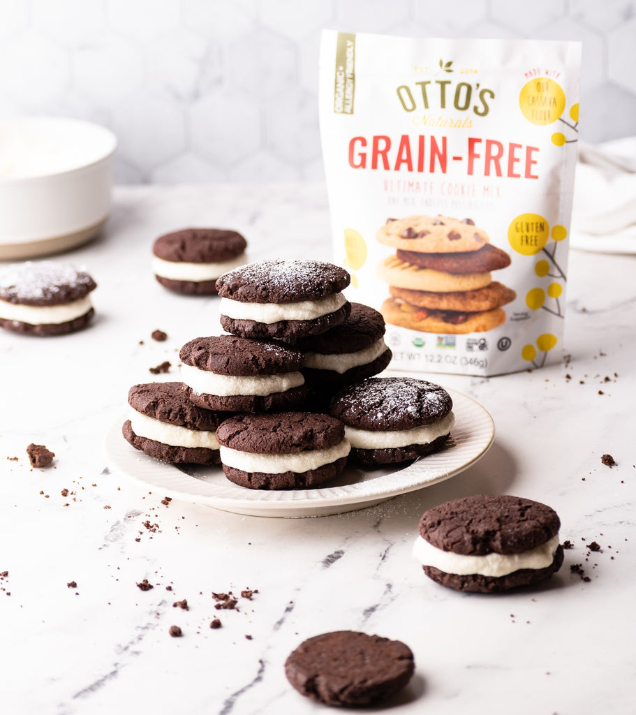 chocolate mint sandwich cookies on plate with Otto's Naturals Grain-Free Ultimate Cookie bag in backrground